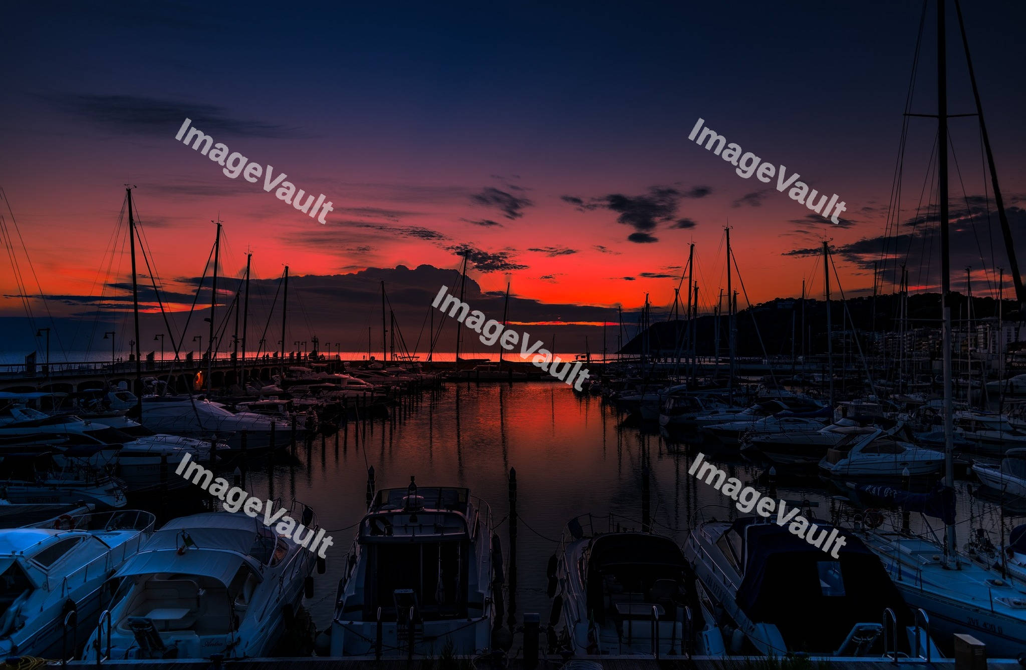 Yacht marina in the sea at sunset